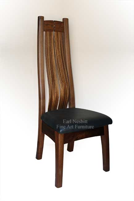 custom made walnut dining room chair with cushioned black leather seat